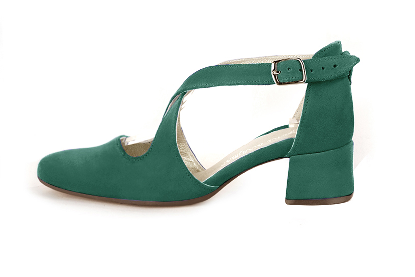 Women's emerald green elegant closed-back heels, with crossed straps. .  - Profile view